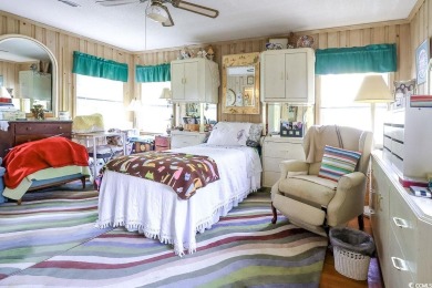 Located just 1,000 feet from the sandy shores of the Atlantic on Whispering Pines in South Carolina - for sale on GolfHomes.com, golf home, golf lot