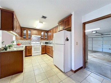 Welcome to your serene waterfront retreat in the highly on Tuscawilla Country Club in Florida - for sale on GolfHomes.com, golf home, golf lot