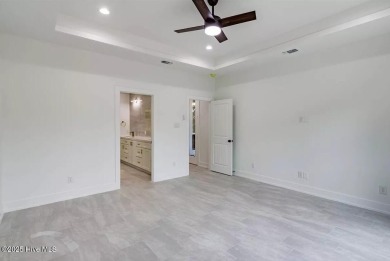 Imagine yourself in this custom built new home with golf course on Sea Trail Golf Resort in North Carolina - for sale on GolfHomes.com, golf home, golf lot
