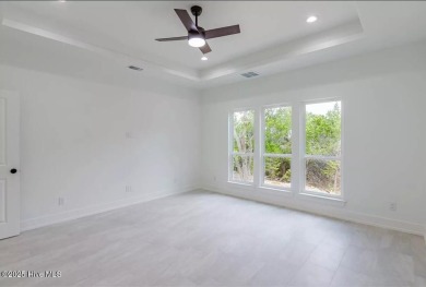 Imagine yourself in this custom built new home with golf course on Sea Trail Golf Resort in North Carolina - for sale on GolfHomes.com, golf home, golf lot