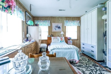 Located just 1,000 feet from the sandy shores of the Atlantic on Whispering Pines in South Carolina - for sale on GolfHomes.com, golf home, golf lot