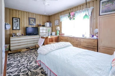 Located just 1,000 feet from the sandy shores of the Atlantic on Whispering Pines in South Carolina - for sale on GolfHomes.com, golf home, golf lot