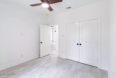 Imagine yourself in this custom built new home with golf course on Sea Trail Golf Resort in North Carolina - for sale on GolfHomes.com, golf home, golf lot