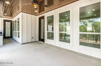 Imagine yourself in this custom built new home with golf course on Sea Trail Golf Resort in North Carolina - for sale on GolfHomes.com, golf home, golf lot