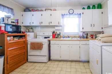 Located just 1,000 feet from the sandy shores of the Atlantic on Whispering Pines in South Carolina - for sale on GolfHomes.com, golf home, golf lot