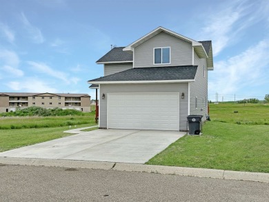 Less time commuting, more time to enjoy home! The warm welcome on Stanley Country Club in North Dakota - for sale on GolfHomes.com, golf home, golf lot