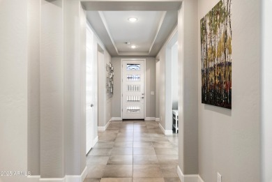 This impeccably maintained residence boasts sophisticated on Tuscany Falls At Pebble Creek in Arizona - for sale on GolfHomes.com, golf home, golf lot