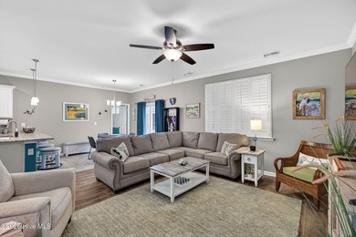 Welcome to this beautifully maintained 3-bedroom, 2-bath coastal on Crow Creek Golf Club in North Carolina - for sale on GolfHomes.com, golf home, golf lot