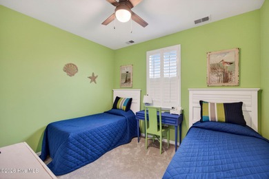 Welcome to this beautifully maintained 3-bedroom, 2-bath coastal on Crow Creek Golf Club in North Carolina - for sale on GolfHomes.com, golf home, golf lot