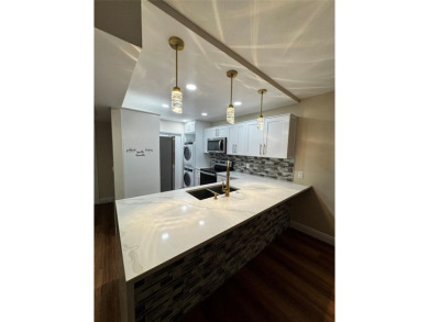 Step into luxury with this beautifully 2/2 condo located in the on Palm-Aire Country Club and Resort - Palms in Florida - for sale on GolfHomes.com, golf home, golf lot