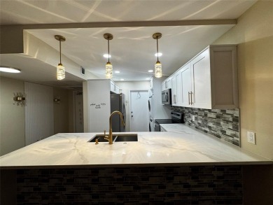Step into luxury with this beautifully 2/2 condo located in the on Palm-Aire Country Club and Resort - Palms in Florida - for sale on GolfHomes.com, golf home, golf lot
