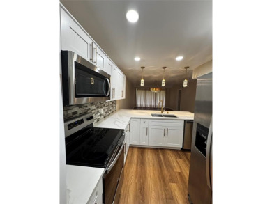 Step into luxury with this beautifully 2/2 condo located in the on Palm-Aire Country Club and Resort - Palms in Florida - for sale on GolfHomes.com, golf home, golf lot