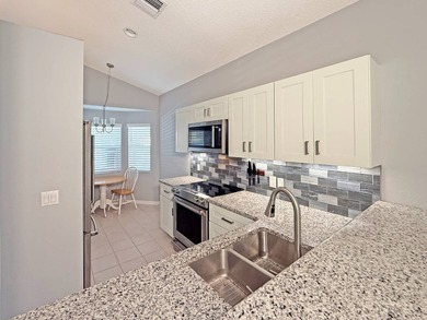 Beautifully renovated villa with golf course and lake views! on The Great Outdoors Golf and Country Club in Florida - for sale on GolfHomes.com, golf home, golf lot