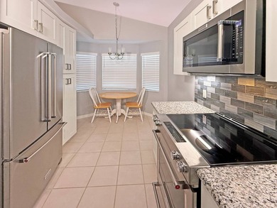 Beautifully renovated villa with golf course and lake views! on The Great Outdoors Golf and Country Club in Florida - for sale on GolfHomes.com, golf home, golf lot