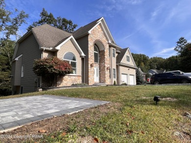 Discover this stunning, newly renovated 4-bedroom, 2.5-bath on Country Club of the Poconos Golf Course in Pennsylvania - for sale on GolfHomes.com, golf home, golf lot