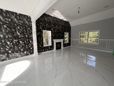 Discover this ultra modern, newly renovated 4-bedroom, 2.5 bath on Country Club of the Poconos Golf Course in Pennsylvania - for sale on GolfHomes.com, golf home, golf lot