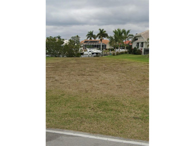 WATERFRONT LOT IN PUNTA GORDA ISLES! Sailboat water, just on Saint Andrews South Golf Club in Florida - for sale on GolfHomes.com, golf home, golf lot