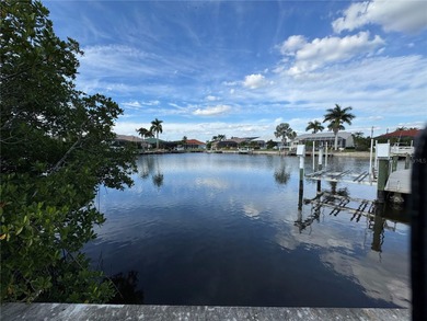 WATERFRONT LOT IN PUNTA GORDA ISLES! Sailboat water, just on Saint Andrews South Golf Club in Florida - for sale on GolfHomes.com, golf home, golf lot