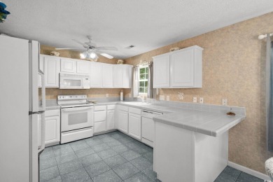Located in the heart of Pawleys Island, this move-in ready on The Founders Club At Pawleys Island in South Carolina - for sale on GolfHomes.com, golf home, golf lot