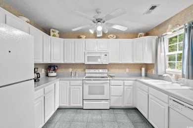 Located in the heart of Pawleys Island, this move-in ready on The Founders Club At Pawleys Island in South Carolina - for sale on GolfHomes.com, golf home, golf lot