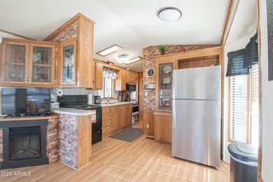 This cute home is located in Carriage Manor Resort, a premier on Fountain of the Sun Country Club in Arizona - for sale on GolfHomes.com, golf home, golf lot