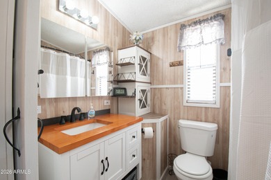 This cute home is located in Carriage Manor Resort, a premier on Fountain of the Sun Country Club in Arizona - for sale on GolfHomes.com, golf home, golf lot