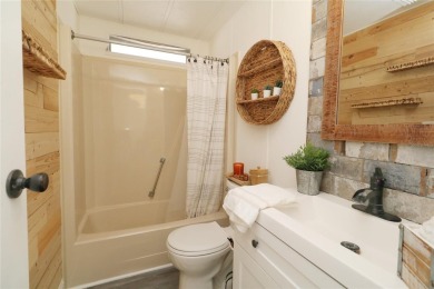 This beautifully updated home in the 55+ waterfront community of on Apollo Beach Golf and Sea Club in Florida - for sale on GolfHomes.com, golf home, golf lot
