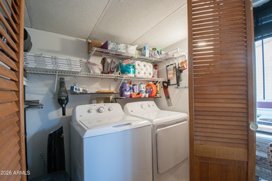 This cute home is located in Carriage Manor Resort, a premier on Fountain of the Sun Country Club in Arizona - for sale on GolfHomes.com, golf home, golf lot