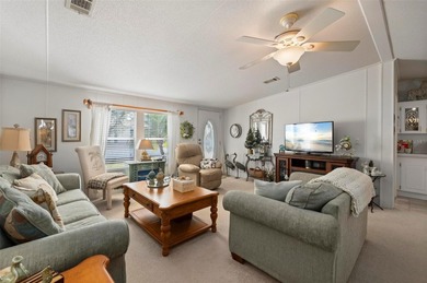 Welcome to this cozy and beautifully maintained 3 bedroom, 2 on Kings Gate Golf Club in Florida - for sale on GolfHomes.com, golf home, golf lot