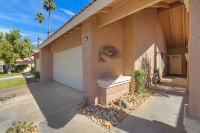 The charming courtyard gracefully lures you into this spacious on Oasis Country Club in California - for sale on GolfHomes.com, golf home, golf lot