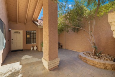 The charming courtyard gracefully lures you into this spacious on Oasis Country Club in California - for sale on GolfHomes.com, golf home, golf lot