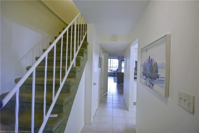 Enjoy maintenance-free living in this beautifully furnished on  in Florida - for sale on GolfHomes.com, golf home, golf lot