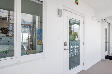 Live as though you're on a tranquil vacation every day in this on Key Colony Beach Golf Course in Florida - for sale on GolfHomes.com, golf home, golf lot