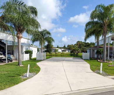 This beautiful RV lot with lake view is ready to a covered port on The Great Outdoors Golf and Country Club in Florida - for sale on GolfHomes.com, golf home, golf lot