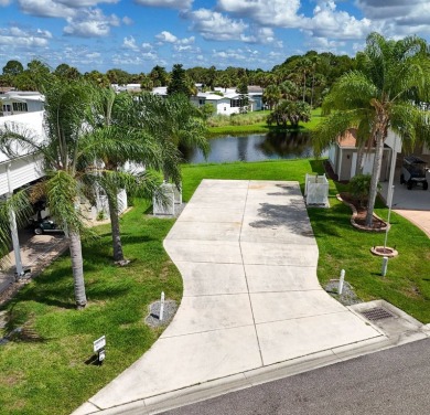 This beautiful RV lot with lake view is ready to a covered port on The Great Outdoors Golf and Country Club in Florida - for sale on GolfHomes.com, golf home, golf lot
