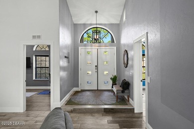 FULLY FURNISHED 5 bedroom 4 bathroom luxurious pool home sits in on Spruce Creek Golf Club in Florida - for sale on GolfHomes.com, golf home, golf lot