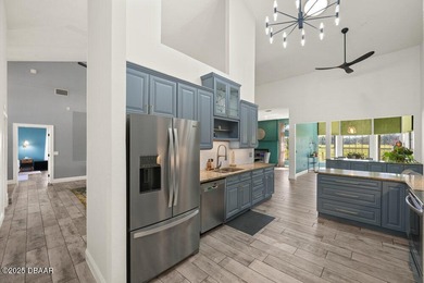 FULLY FURNISHED 5 bedroom 4 bathroom luxurious pool home sits in on Spruce Creek Golf Club in Florida - for sale on GolfHomes.com, golf home, golf lot