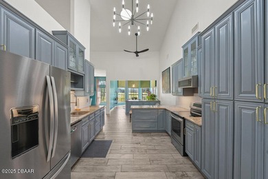 FULLY FURNISHED 5 bedroom 4 bathroom luxurious pool home sits in on Spruce Creek Golf Club in Florida - for sale on GolfHomes.com, golf home, golf lot