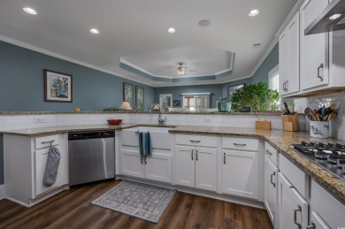 Welcome to this elegant 4-bedroom (plus 1 non-conforming) lake on Wild Wing Plantation in South Carolina - for sale on GolfHomes.com, golf home, golf lot