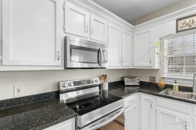 This classic Southern house sits on a corner lot in the heart of on Lake Forest Yacht and Country Club in Alabama - for sale on GolfHomes.com, golf home, golf lot