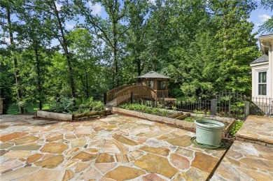 Tucked in Atlanta Country Club's quiet interior, this European on Atlanta Country Club in Georgia - for sale on GolfHomes.com, golf home, golf lot