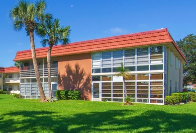 Beautifully updated first-floor unit with golf views! Desirable on The American Golf Club in Florida - for sale on GolfHomes.com, golf home, golf lot