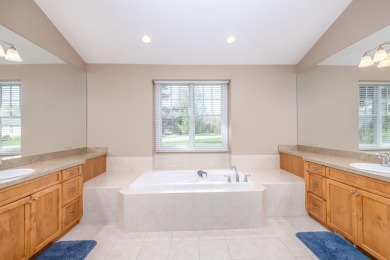 Experience refined waterfront living at its finest with this on Tullymore Golf Club in Michigan - for sale on GolfHomes.com, golf home, golf lot