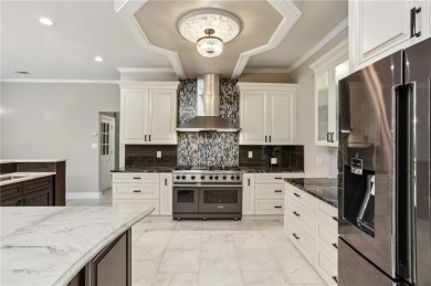Tucked in Atlanta Country Club's quiet interior, this European on Atlanta Country Club in Georgia - for sale on GolfHomes.com, golf home, golf lot