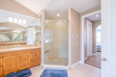 Experience refined waterfront living at its finest with this on Tullymore Golf Club in Michigan - for sale on GolfHomes.com, golf home, golf lot