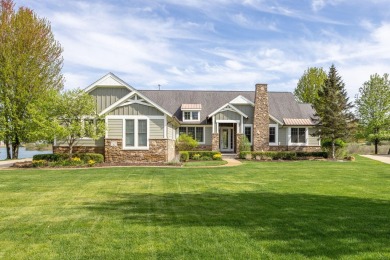 Experience refined waterfront living at its finest with this on Tullymore Golf Club in Michigan - for sale on GolfHomes.com, golf home, golf lot