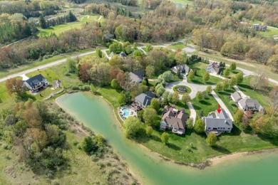 Experience refined waterfront living at its finest with this on Tullymore Golf Club in Michigan - for sale on GolfHomes.com, golf home, golf lot