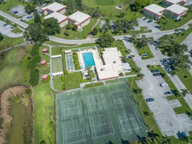 Beautifully updated first-floor unit with golf views! Desirable on The American Golf Club in Florida - for sale on GolfHomes.com, golf home, golf lot