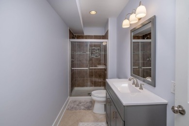 Experience refined waterfront living at its finest with this on Tullymore Golf Club in Michigan - for sale on GolfHomes.com, golf home, golf lot