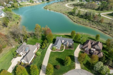Experience refined waterfront living at its finest with this on Tullymore Golf Club in Michigan - for sale on GolfHomes.com, golf home, golf lot